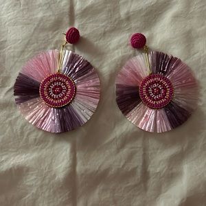 Handmade pink earrings with beads in the middle